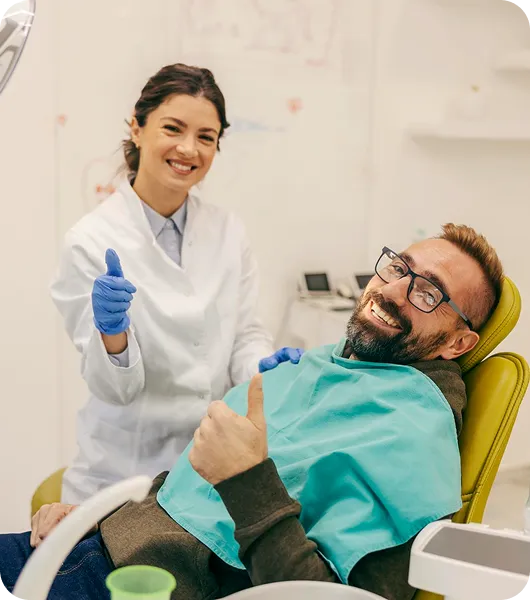Patient and staff in dental clinic