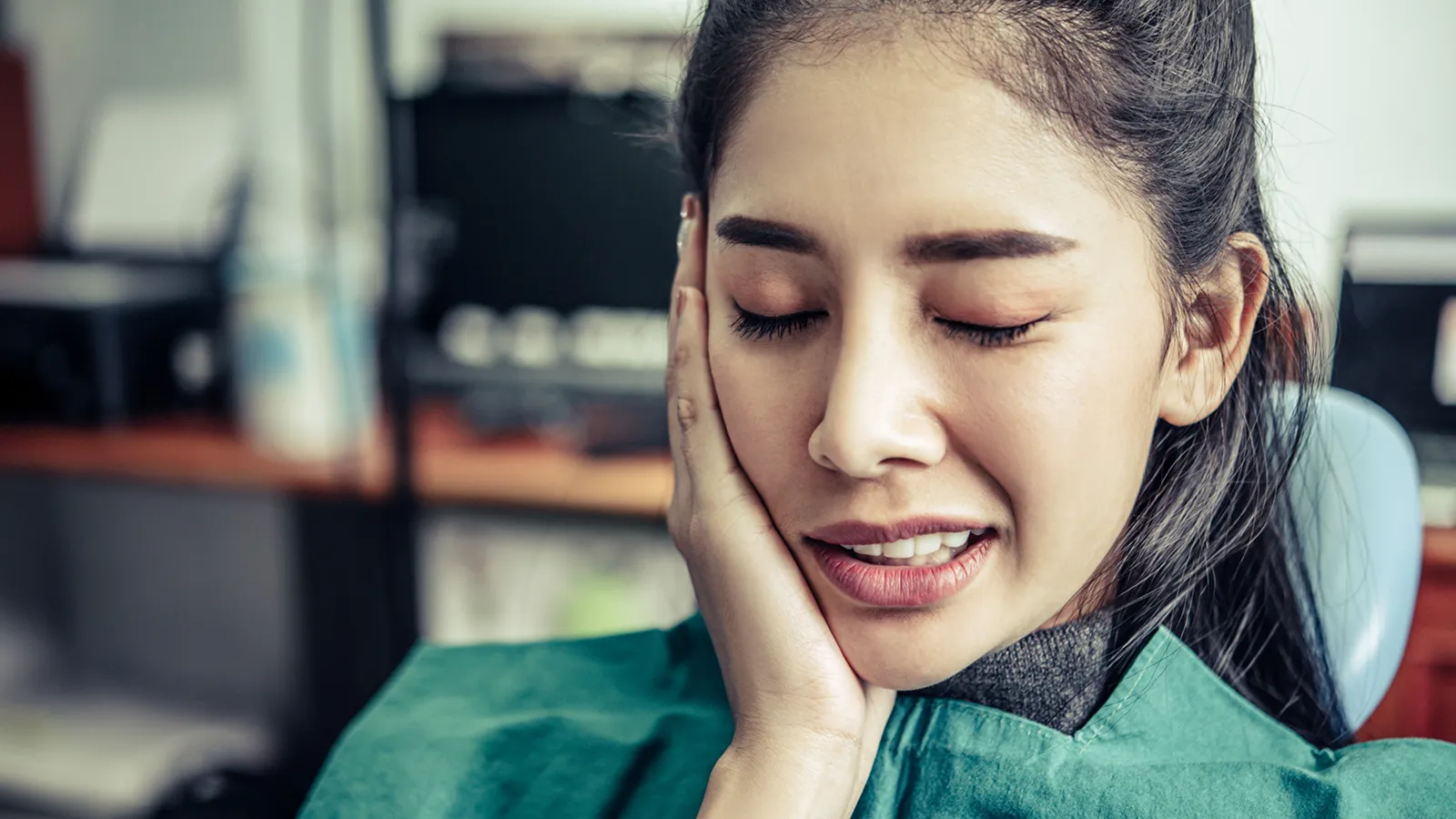 Patient in dental chair during teeth extraction consultation