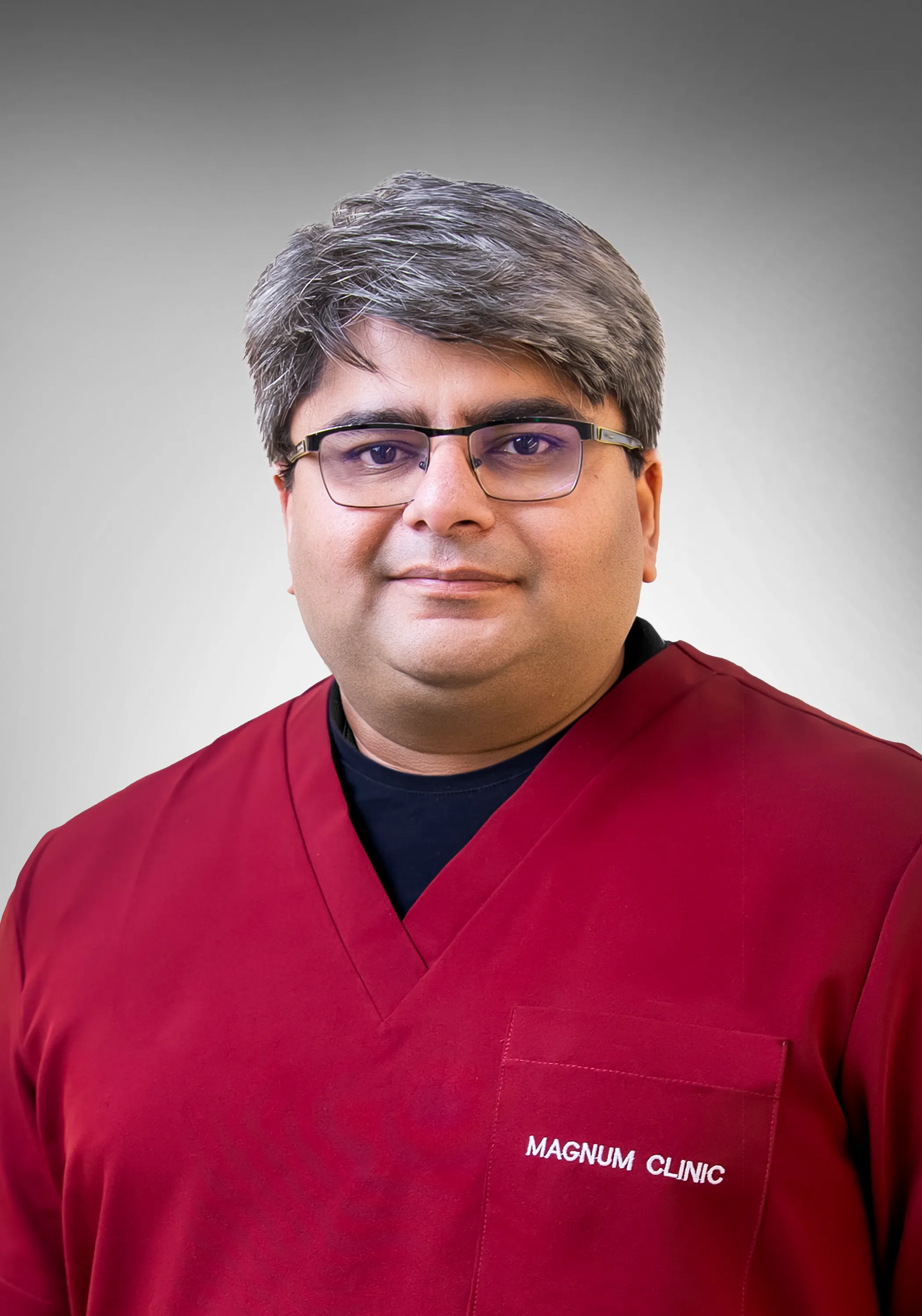 Dr. Alok providing periodontal care at Magnum Dental Clinic Dubai