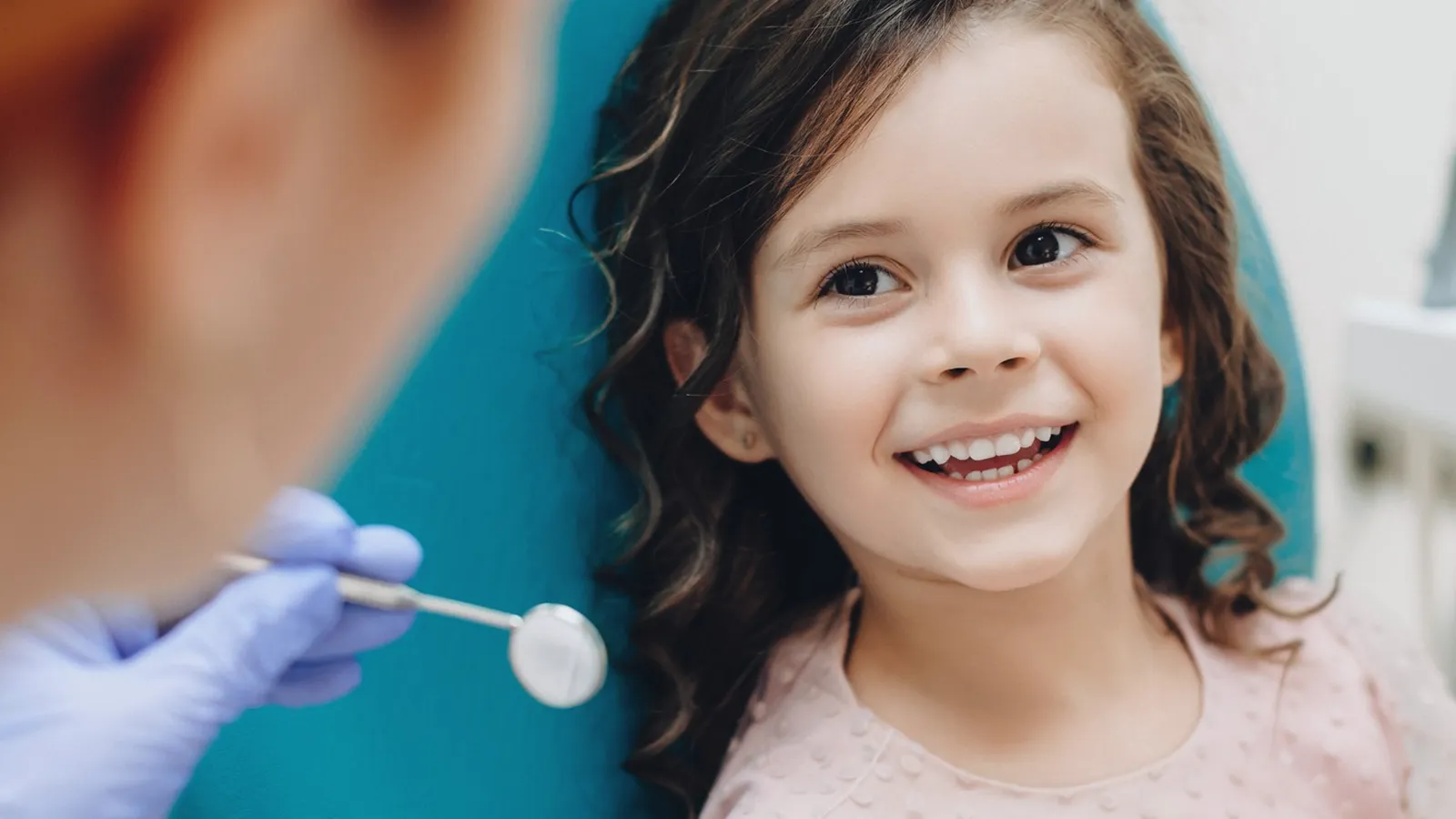 Patient in dental chair during teeth extraction consultation