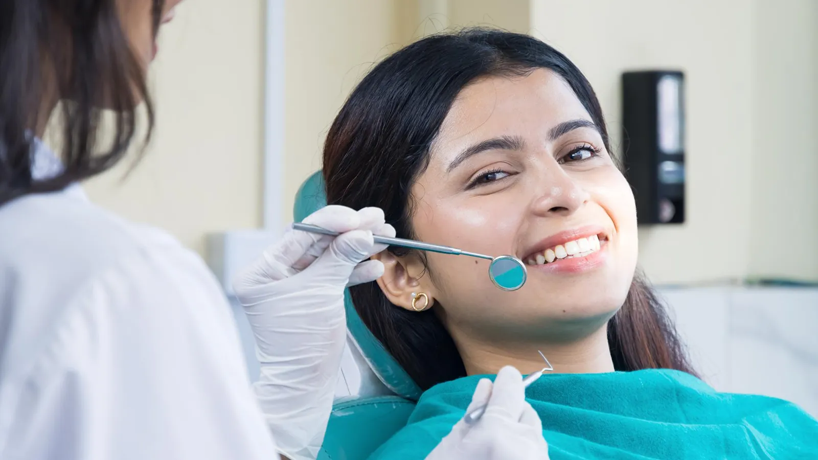 Patient in dental chair during teeth extraction consultation